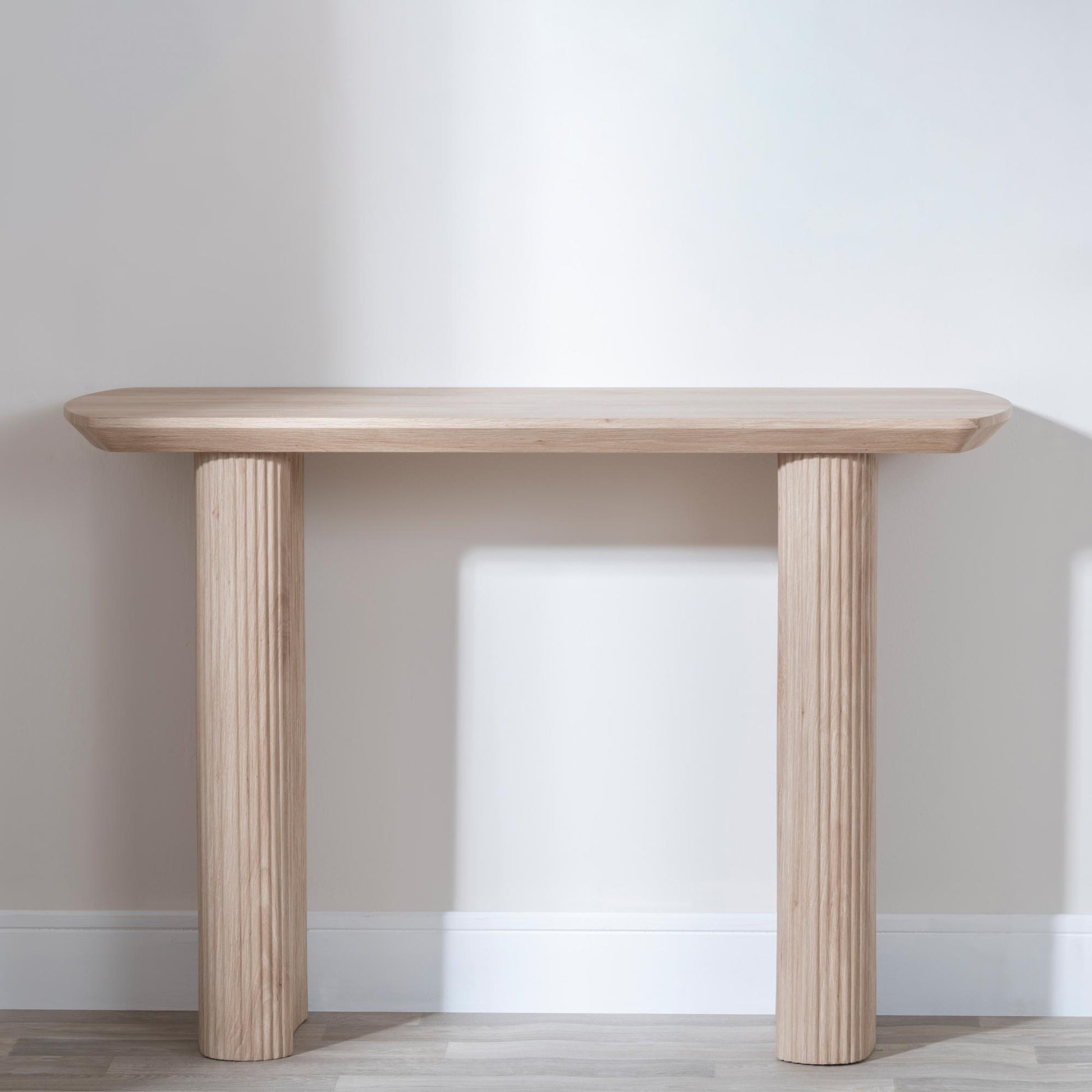 Renzo Oak Oval Console Table with Fluted Ribbed Drum Base